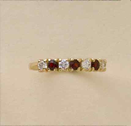 GPC CZ/GARNET 7 STONE ETERNITY RING    =