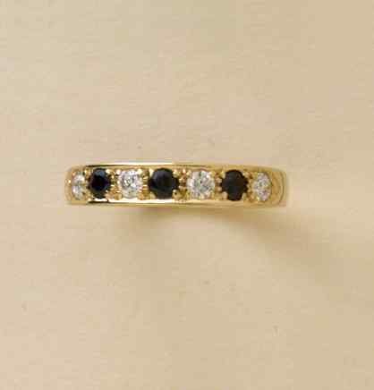 GPC CZ/SAPPHIRE 7 ST ETERNITY RING     =