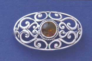 SPC AMBER OVAL CUTOUT BROOCH           =