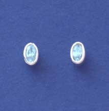 SPC 7x5mm OVAL BLUE TOPAZ STUDS        =