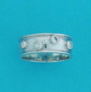 SPC 4 CZ STONES ON 7mm BAND            -